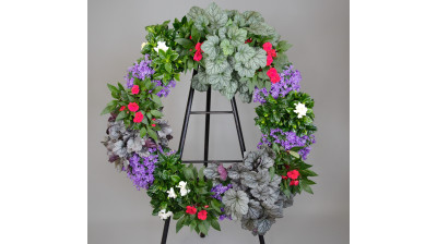 Corona compuesta por planta guineanas, planta begonias, planta campanula